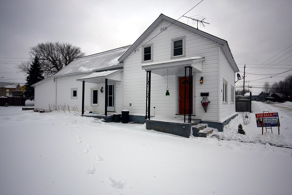 Vinyl siding installation on residential home exterior facade